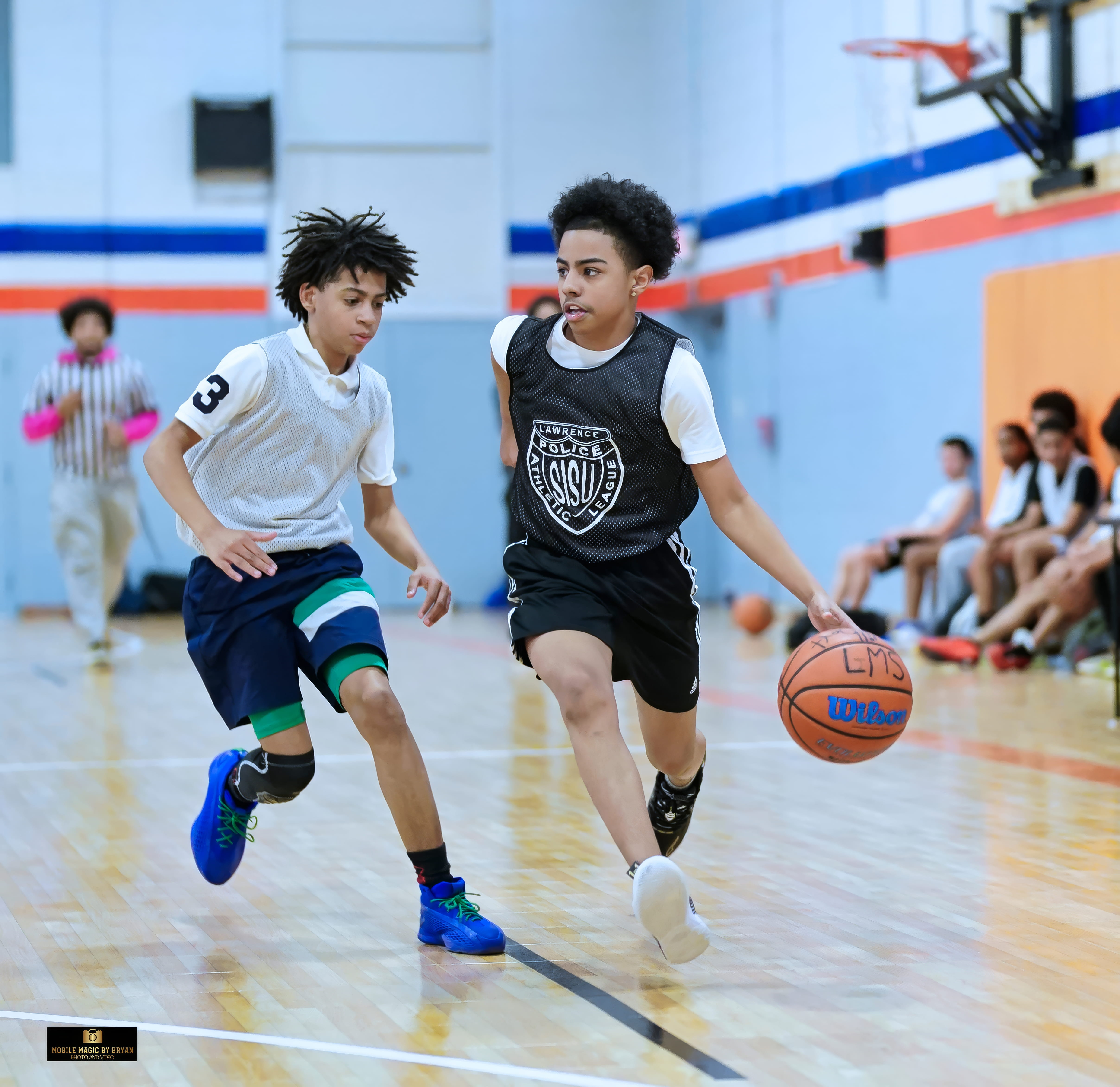 Youth playing basketball at the SISU Center
